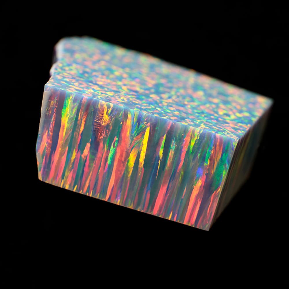 Bello Opal synthetic opal rough material in multiple colors showing vivid play-of-color